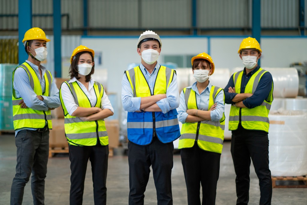 Warehouse workers standing together confidently